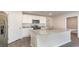 Bright kitchen with stainless steel appliances, granite countertops, large island, and neutral paint colors at 411 Acosta Circle, Conway, SC 29527