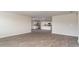 Open concept living room showing neutral colors, hardwood floors, and view into the kitchen at 411 Acosta Circle, Conway, SC 29527