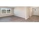 Living room featuring a large window providing natural light and wood-look flooring at 411 Acosta Circle, Conway, SC 29527