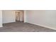 Neutral living room with a hallway and doorway entrance with wood-look flooring at 411 Acosta Circle, Conway, SC 29527
