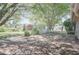 View of the back deck, offering a tranquil outdoor space shaded by mature trees and greenery, with access to a backyard shed at 4300 Cross Cut Trail, Myrtle Beach, SC 29579