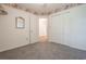 This carpeted bedroom has floral wallpaper and closet space at 4300 Cross Cut Trail, Myrtle Beach, SC 29579