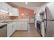 Modern kitchen with white cabinets, stainless steel appliances, and a stylish backsplash at 4300 Cross Cut Trail, Myrtle Beach, SC 29579