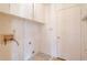 Empty laundry room showing hookups, storage and a back door at 4300 Cross Cut Trail, Myrtle Beach, SC 29579