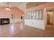 Spacious living room with a fireplace and large mirrors, complemented by modern flooring and neutral tones at 4300 Cross Cut Trail, Myrtle Beach, SC 29579
