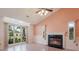 Bright living room featuring a fireplace, large windows, and modern flooring, creating an inviting space at 4300 Cross Cut Trail, Myrtle Beach, SC 29579