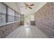 Covered patio featuring brick walls, tile floor and ceiling fan at 4300 Cross Cut Trail, Myrtle Beach, SC 29579