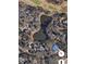 An aerial view of homes surrounding a pond and golf course in a lush, upscale community at 4535 Carriage Run Circle, Murrells Inlet, SC 29576