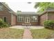 Brick home featuring a backyard patio with seating, perfect for entertaining at 4535 Carriage Run Circle, Murrells Inlet, SC 29576