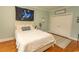 Bedroom with hardwood floors, white bedding, and ample closet space for storage at 4535 Carriage Run Circle, Murrells Inlet, SC 29576