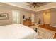 Spacious primary bedroom boasts tray ceiling, hardwood floors, and neutral paint at 4535 Carriage Run Circle, Murrells Inlet, SC 29576