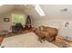 Cozy bonus room with desk, sofa, and skylights for plenty of natural light at 4535 Carriage Run Circle, Murrells Inlet, SC 29576