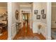 Inviting foyer featuring hardwood floors, wainscoting, and elegant decor sets a welcoming tone at 4535 Carriage Run Circle, Murrells Inlet, SC 29576