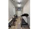 Bright home gym featuring a treadmill, exercise bike, and television at 4535 Carriage Run Circle, Murrells Inlet, SC 29576