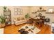 Cozy home office featuring a comfortable sofa, wooden desk, and hardwood floors at 4535 Carriage Run Circle, Murrells Inlet, SC 29576