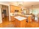 Open concept kitchen featuring stainless steel appliances, custom cabinets, and quartz countertops at 4535 Carriage Run Circle, Murrells Inlet, SC 29576