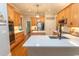 Spacious kitchen with stainless steel appliances, custom cabinets, and a large island with quartz countertops at 4535 Carriage Run Circle, Murrells Inlet, SC 29576