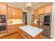 Kitchen with stainless steel appliances, custom cabinets, and a large island with quartz countertops at 4535 Carriage Run Circle, Murrells Inlet, SC 29576