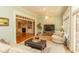 Bright living room with fireplace, comfortable seating, and large windows offering natural light at 4535 Carriage Run Circle, Murrells Inlet, SC 29576