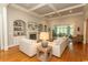 Bright living room with coffered ceilings, fireplace, and built-in shelving exudes comfort at 4535 Carriage Run Circle, Murrells Inlet, SC 29576