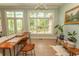 Sunroom with large windows, tile floor, and unique live edge table, bringing the outdoors in at 4535 Carriage Run Circle, Murrells Inlet, SC 29576