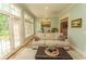 Inviting sun room with large windows, tile flooring, and comfortable seating at 4535 Carriage Run Circle, Murrells Inlet, SC 29576
