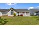 Beautiful backyard with a well-manicured lawn and bright landscaping at 4591 Hidden Creek Ln., Myrtle Beach, SC 29579