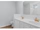 Bathroom with dual sink vanity, white cabinets, and gold fixtures at 4591 Hidden Creek Ln., Myrtle Beach, SC 29579