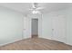 Bedroom with wood look tile, ceiling fan and closet at 4591 Hidden Creek Ln., Myrtle Beach, SC 29579