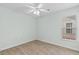Bright bedroom featuring wood look tile floors and a ceiling fan at 4591 Hidden Creek Ln., Myrtle Beach, SC 29579