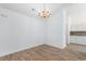 Dining area features hard wood flooring, white walls, and a decorative light fixture at 4591 Hidden Creek Ln., Myrtle Beach, SC 29579