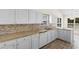 Kitchen with white cabinets, stainless steel sink, and tiled backsplash at 4591 Hidden Creek Ln., Myrtle Beach, SC 29579
