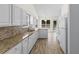 Spacious kitchen featuring granite countertops, tiled backsplash, ample cabinet space, and modern appliances at 4591 Hidden Creek Ln., Myrtle Beach, SC 29579