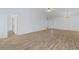 Open-concept space with wood-look floors leads to the front door and adjacent rooms, offering a seamless flow at 4591 Hidden Creek Ln., Myrtle Beach, SC 29579