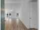 Bright living room with wood-look floors, neutral paint, a ceiling fan, and large windows for natural light at 4591 Hidden Creek Ln., Myrtle Beach, SC 29579