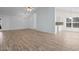 Spacious living area with wood-look floors offers views of the kitchen and entry, blending functionality and style at 4591 Hidden Creek Ln., Myrtle Beach, SC 29579