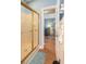 Bathroom featuring a gold-framed shower and view to living area at 4741 Wild Iris Dr. # 303, Myrtle Beach, SC 29577