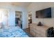 Bedroom with view to living area, bathroom and closet at 4741 Wild Iris Dr. # 303, Myrtle Beach, SC 29577