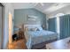 Cozy bedroom featuring a light-blue wall, picture window, and an ocean-themed painting at 4741 Wild Iris Dr. # 303, Myrtle Beach, SC 29577