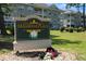 Magnolia Place community sign with lush landscaping and flowers at 4741 Wild Iris Dr. # 303, Myrtle Beach, SC 29577
