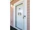 Charming condo front door with welcome bicycle decor and Ring doorbell, offering security and curb appeal at 4741 Wild Iris Dr. # 303, Myrtle Beach, SC 29577