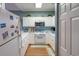 Charming kitchen with white cabinets, stainless appliances, and a cozy design at 4741 Wild Iris Dr. # 303, Myrtle Beach, SC 29577