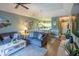 Comfortable living area adjacent to the dining area and kitchen featuring hardwood floors and modern design at 4741 Wild Iris Dr. # 303, Myrtle Beach, SC 29577