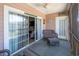 Outdoor patio with wicker seating, sliding glass door, and decor at 4741 Wild Iris Dr. # 303, Myrtle Beach, SC 29577