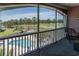 Screened-in porch with views of the pool, golf course, and trees at 4741 Wild Iris Dr. # 303, Myrtle Beach, SC 29577