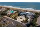 Aerial view of the community clubhouse and pool, located steps from the beach and ocean at 487 Lantana Circle, Georgetown, SC 29440