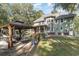 Expansive backyard featuring an outdoor seating area, gazebo, and lush landscaping at 487 Lantana Circle, Georgetown, SC 29440