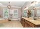 Luxurious bathroom with a double vanity, soaking tub, and natural light, creating a spa-like atmosphere at 487 Lantana Circle, Georgetown, SC 29440