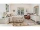 Cozy bedroom with a queen bed, chair, and ample natural light at 487 Lantana Circle, Georgetown, SC 29440