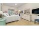 Cozy bedroom with carpet, a queen-sized bed, a dresser with a mirror, and a view to the bathroom at 487 Lantana Circle, Georgetown, SC 29440